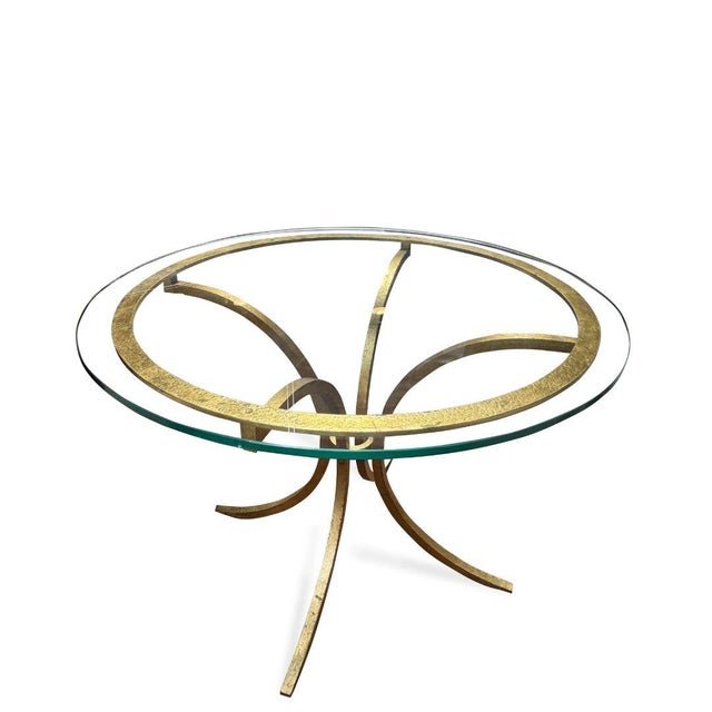 The Gilt Round Iron Table by Roger Thibier is a striking example of refined French design, where sculptural form meets...