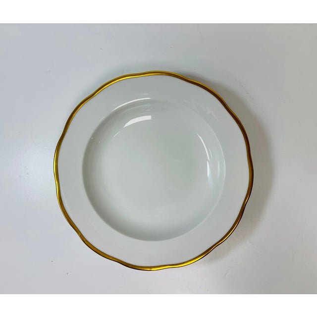 Simply elegant, Gwendolyn is a pristine design of 24 karat gold edging on a graceful scalloped shape. It offers the ideal...