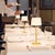 The Poldina Classic cordless, rechargeable battery lamp by Zafferano reimagines the traditional table lamp with a...