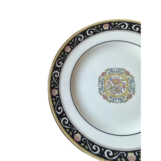 This Wedgwood Runnymede-Blue bone china plate is a wonderful way to add an extra touch of elegance to your table. A...