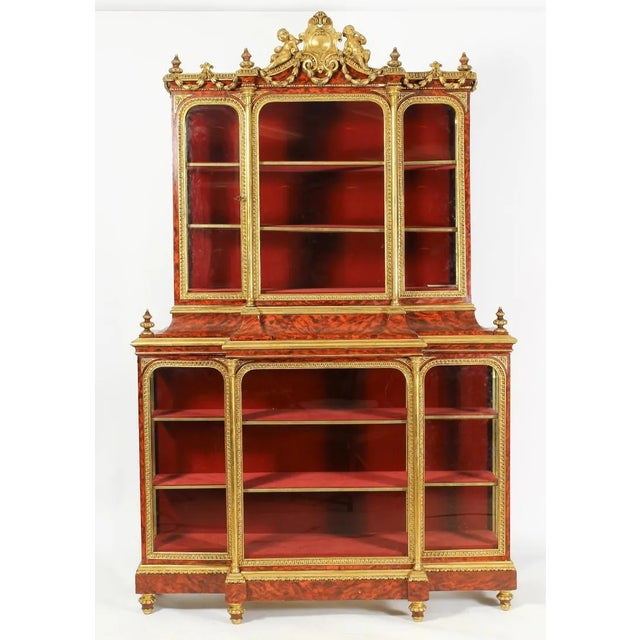 Venetian Inspired Louis XIV Style Vitrine Cabinet with FAUX tortoiseshell and gilt wood finish, central frieze surmounted...