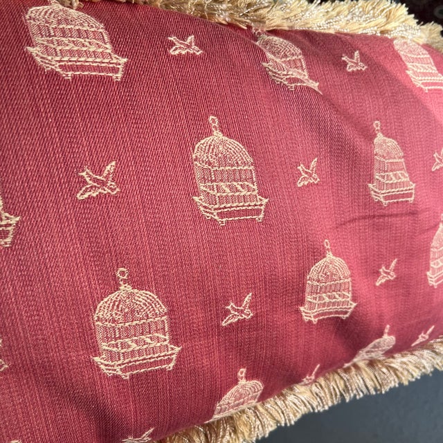 Pair of pink Palm Beach style pillows. Design features birds & birdcages. One pillow has a corded trim and an envelope...
