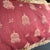 Pair of pink Palm Beach style pillows. Design features birds & birdcages. One pillow has a corded trim and an envelope...