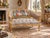 This elegant circa 1975 French Louis XVI–style settee combines finely carved beechwood, luminous gold leaf, rich tan...