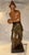 This listing is for a mid century ceramic sculpture of a male performer. The performer wears a hat and holds percussion...