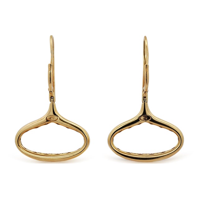 Italian-made 14K yellow gold wide oval drop earrings feature 0.28 carats of natural round brilliant diamonds in a bold 3.0...