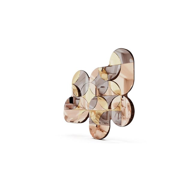 MARQUEYSSAC is a modern wall mirror with details in wood and polished stainless steel with brass, copper, and nickel...