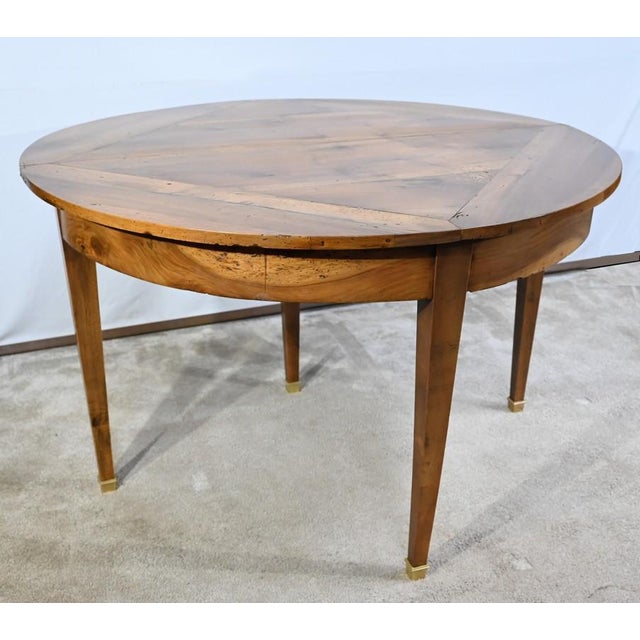 This table console in solid walnut with a half-moon double tray rests on three feet gained on the facade ending with brass...