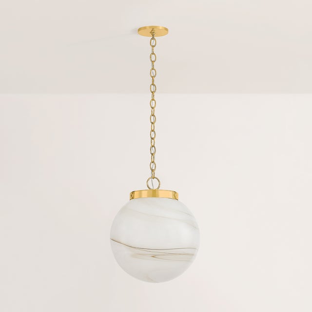 The Ambra pendant's simplistic silhouette allows its distinctive glass technique to shine. Hand-blown in Mitzi’s factory,...