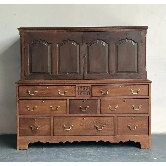 Step back in time with this remarkable antique English Mule Chest, a true testament to enduring craftsmanship and...