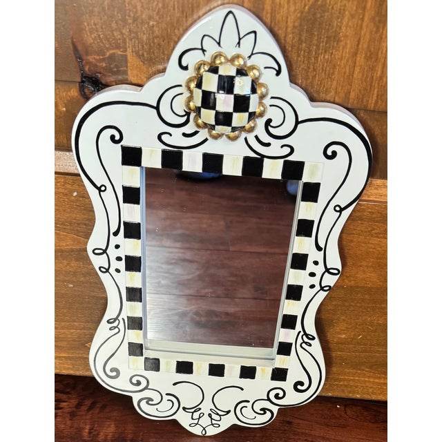 Featuring the playful “Doodles” pattern with hand-drawn black scrollwork, accented by the brand’s iconic Courtly Check...