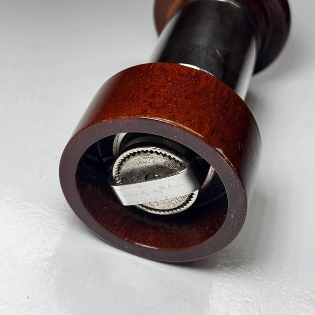 Authentic Christofle pepper mill with silver-plated band and polished wood body • Features a high-quality Peugeot grinding...