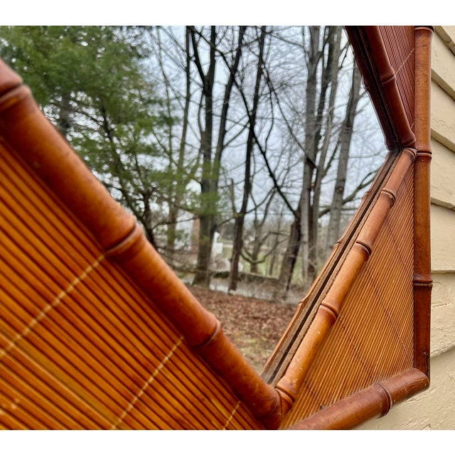 Transform the ordinary into something special with this uniquely faux bamboo wood mirror. The mirror is a diamond in the...