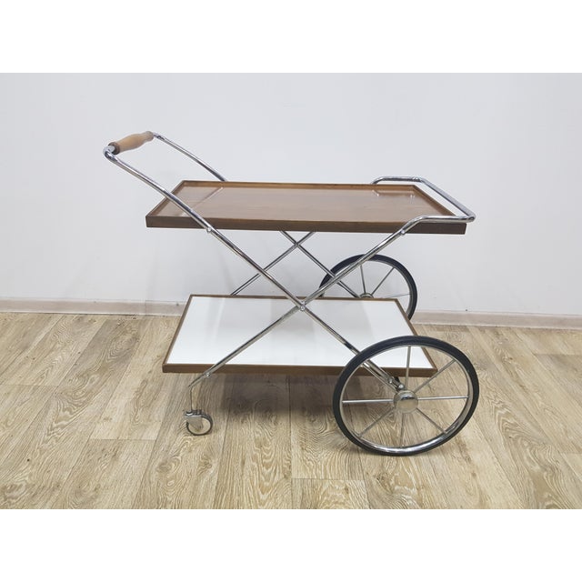 Signature mobile bar by Ilse Möbel, manufactured in the 1960s. Original condition, visible signs of use. Dimensions:...