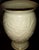 Creamy 8-inch-tall Lenox Vase with 24k gold trim on top rim and bottom. The vase features raised Lilies and is made of...