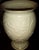 Creamy 8-inch-tall Lenox Vase with 24k gold trim on top rim and bottom. The vase features raised Lilies and is made of...