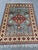 Hand-Knotted Blue and Red Afghan Medallion Wool Area Rug, 6'9" X 5'0 For Sale - Image 6 of 12