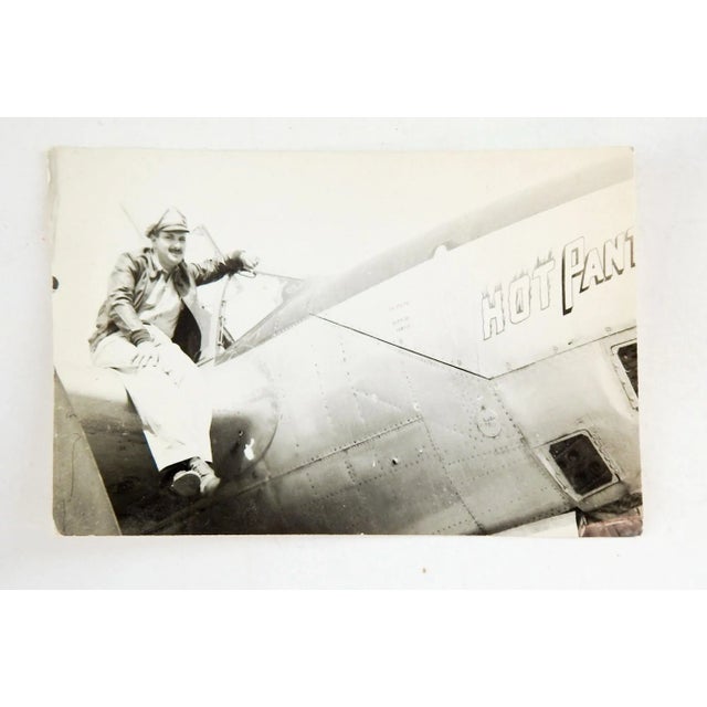 2 WWII c. 1945 nose art photographs of P-38 Lightning fighter airplane. Named Hot Pants with pilot. Good condition, some...