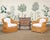 A stylish pair of 20th century organic modern lounge armchairs crafted out of woven wicker, rattan, and bamboo. The chairs...