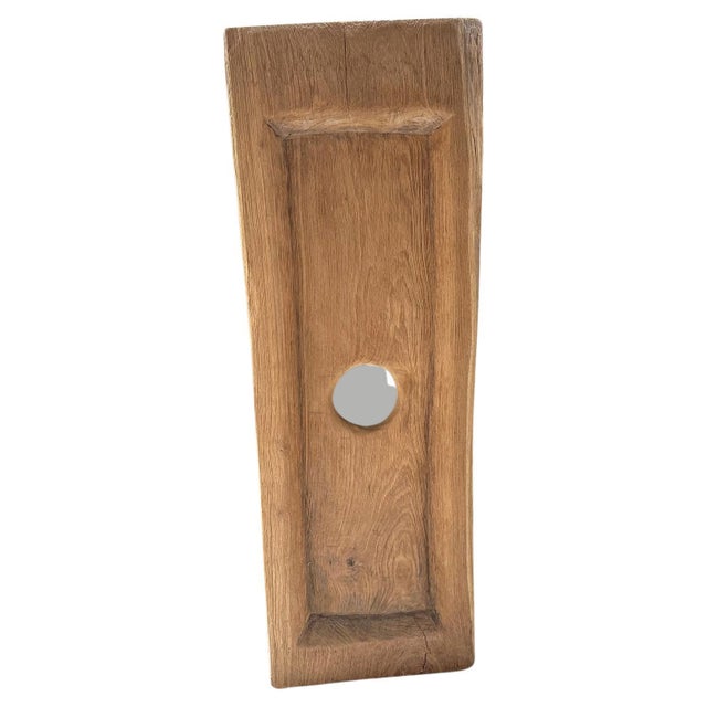 A single three inch thick old teak slab is hand carved into this minimalist wall hanging or tray. This can also be used as...