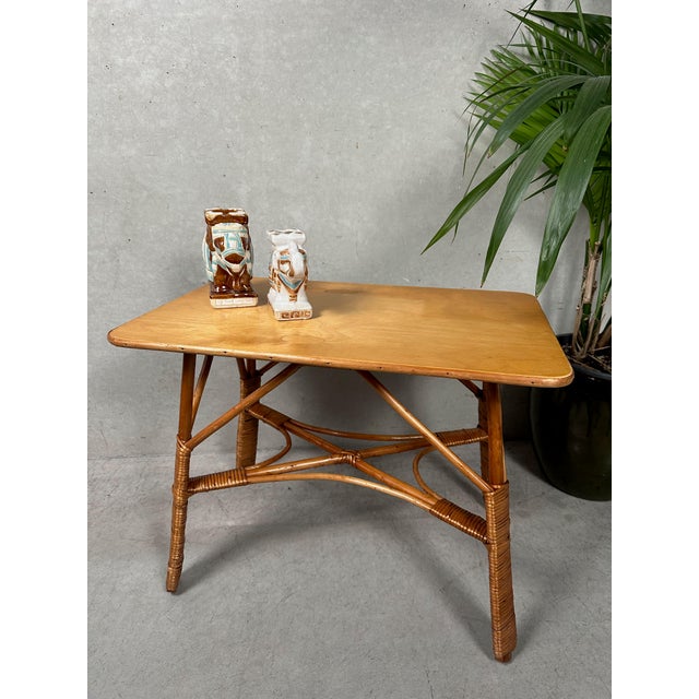 Rattan table in good condition. Height: 47cm. Top: 61cm x 40cm. It fits perfectly in a boho-style space and can serve as a...