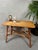 Rattan table in good condition. Height: 47cm. Top: 61cm x 40cm. It fits perfectly in a boho-style space and can serve as a...