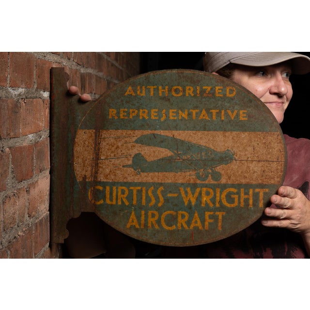 Industrial flanged metal advertising sign for Curtiss-Wright Aircraft featuring the words "AUTHORIZED REPRESENTATIVE"...