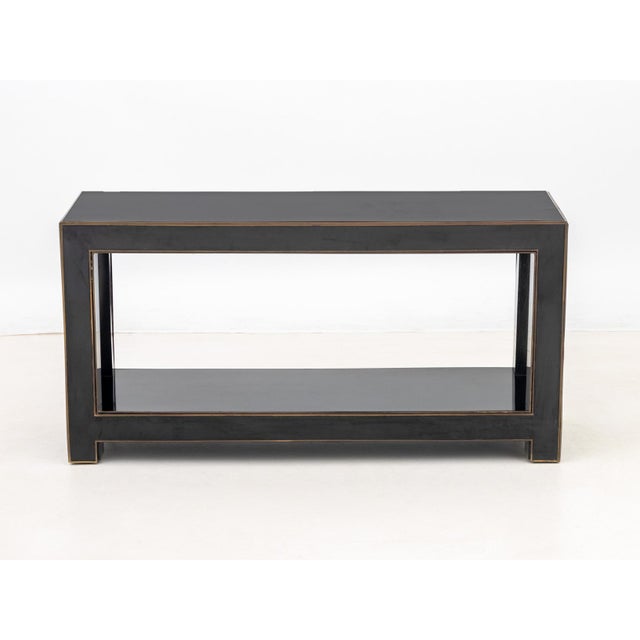 Maison Jansen Attributed Black Lacquered Brass Banded Console Table, with four legs conjoined by undertier, in the style...