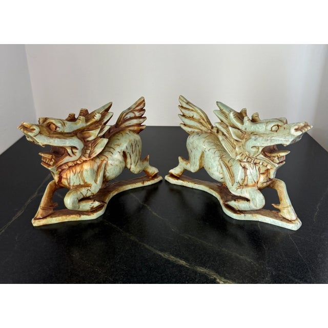 Stunning pair of antique hand carved stone, likely jade, Qilin figures. These are heavy; the carvings are very detailed....