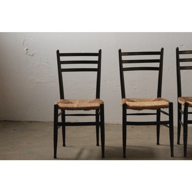 This is a beautiful set of 4 mid-century dining chairs from Gessef Consorzio Sedie Friuli, Italy. The papercord seats are...