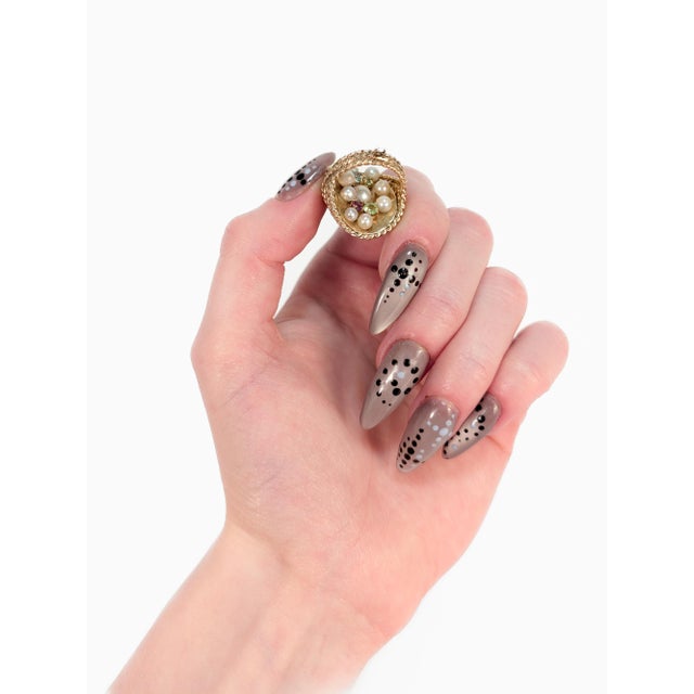 A fine vintage gold, pearl, and tourmaline figural charm for a bracelet. In 14 karat yellow gold. In the form of a...
