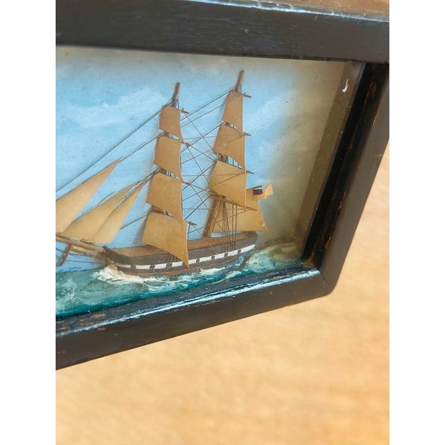 This is a charming vintage maritime diorama with classic nautical appeal. Description: Vintage handcrafted sailing ship...
