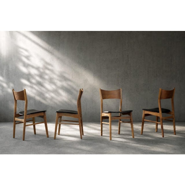 This set of four chairs was made in Denmark during the 1960s. The frame is made of beech wood in a warm shade of brown....