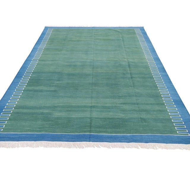 Cotton Zig Zag Pattern Reversible Rug. Fringe runs along 12' sides. These special flat-weave dhurries are hand-woven with...