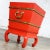 Handsome Chinese red lacquer and brass ice chest, planter, accent table with galvanized insert and lid on hoof foot style...