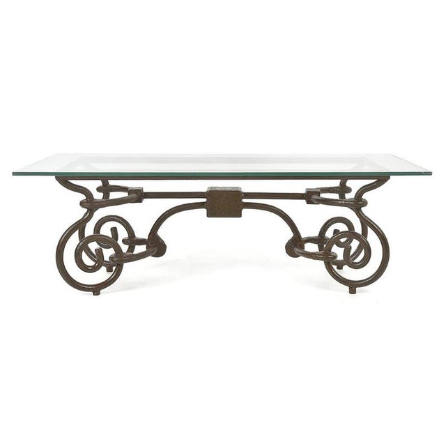 A perfect combination of glass and metal, this coffee table captivates with the strength of its cast iron structure and...