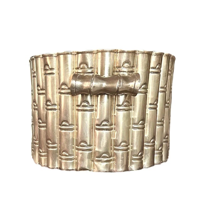 A gorgeous, brass faux bamboo cache pot/planter. Features an oval form with cast faux bamboo detailing. Adorned with brass...