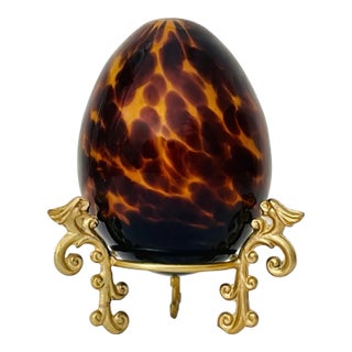 Vintage Decorative Amber Tortoiseshell Glass Egg on Gilt Metal Stand For Sale