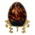 Vintage Decorative Amber Tortoiseshell Glass Egg on Gilt Metal Stand For Sale