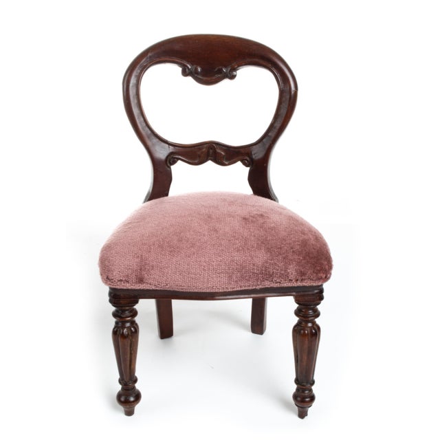 A 19th century salesman sample of a Victorian mahogany balloon-back side chair with a carved, scrolling crest rail, open...