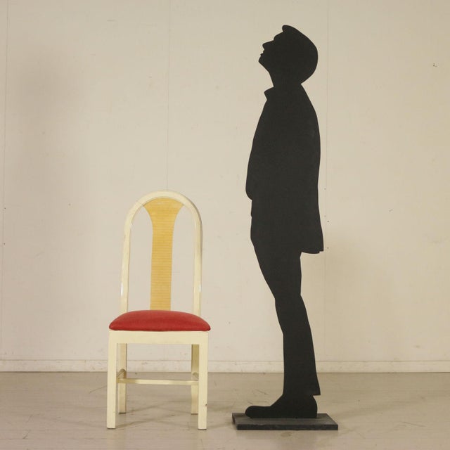 Group of 4 chairs in lacquered wood, back covered with synthetic material and ivory imitation, foam padding, and fabric...