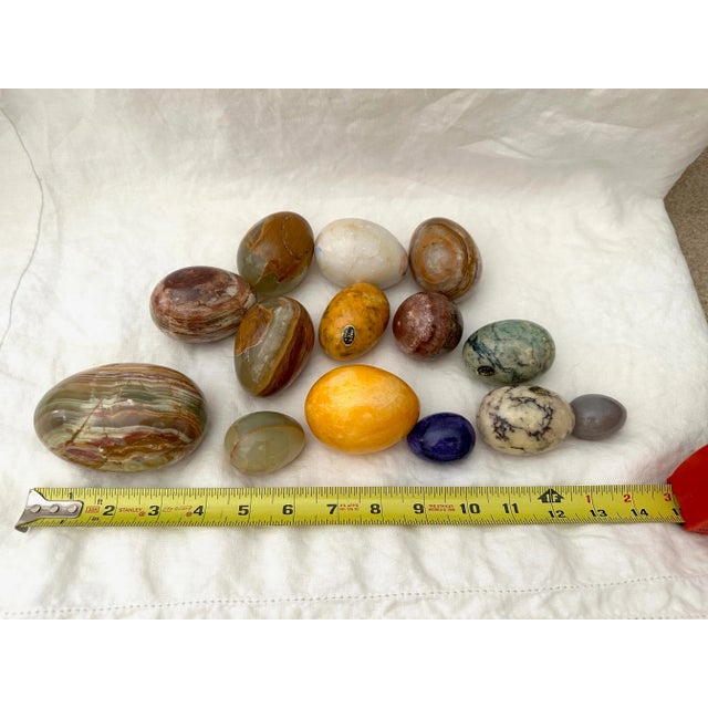 Vintage set of 14 polished eggs of natural stone marble, alabaster, onyx etc. Perfect displayed in a glass bowl on a...