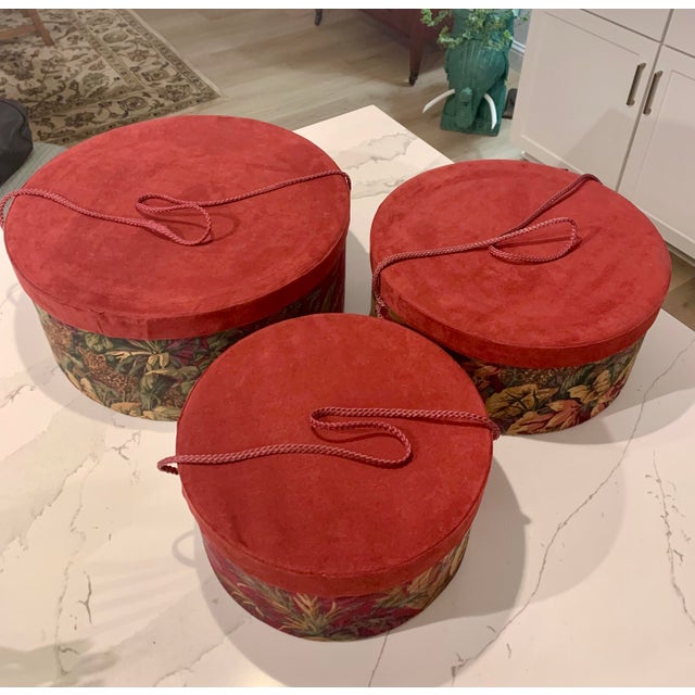 What an exciting find! Nesting hat boxes in very good condition - botanical tapestry boxes with cranberry velvet tops and...