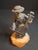 This vintage Israeli Judaica sculpture by renowned artist Fay Avishay depicts a traditional Hasidic musician playing a...