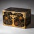 Small rectangular Japanese chest with gold lacquer decoration in the form of leaf tendrils. The chest is decorated with...