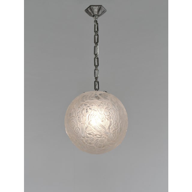 Hettier & Vincent A French 1925-1935 art deco pendant light by Hettier et Vincent in nickel plated bronze. The mounting...