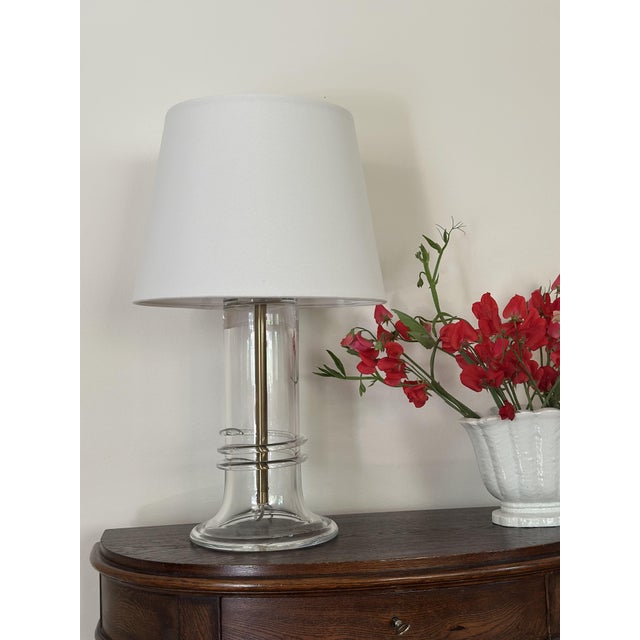 Atelje Lyktan Glass Table Lamp with brass stem & body in Clear Glass. Produced and manufactured in Sweden during the...