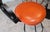 Vintage Spanish Revival Wrought Iron Swivel Bar Stool Set With Matching Mesh Bar Table & Heavy Umbrella Stand – Mid-Century, Orange Vinyl For Sale - Image 4 of 12