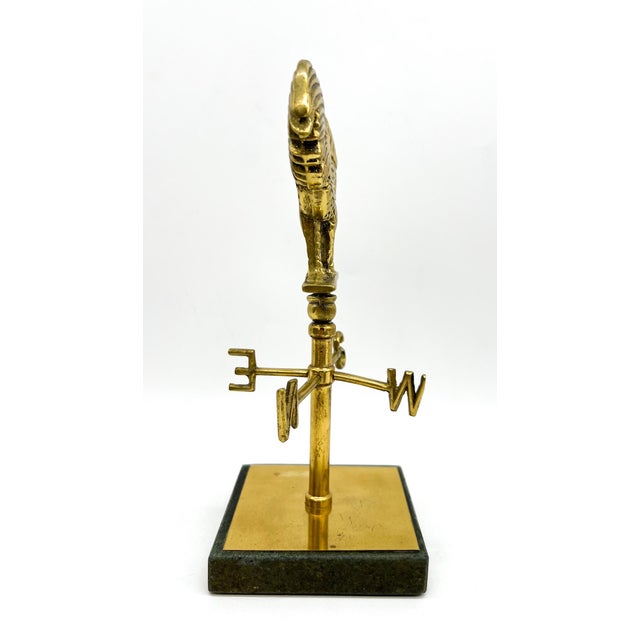 Striking vintage English desk-scale weathervane sculpture featuring a finely detailed rooster cast in solid brass, mounted...