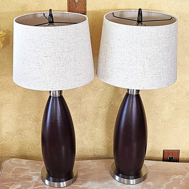 Pair of Contemporary Espresso Wood Hourglass Lamps With Brushed Nickel Accents and Linen Shades For Sale - Image 17 of 18